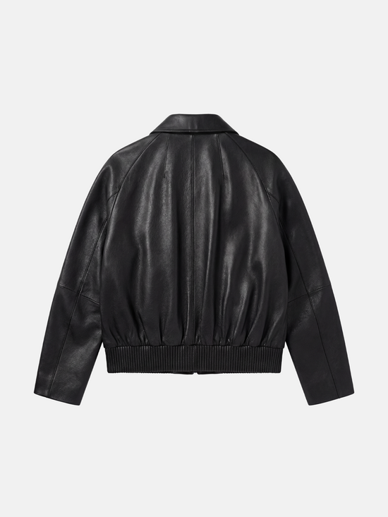SELVANE deep black lambskin button bomber, cropped silhouette with ribbed hem and oversized patch pockets.