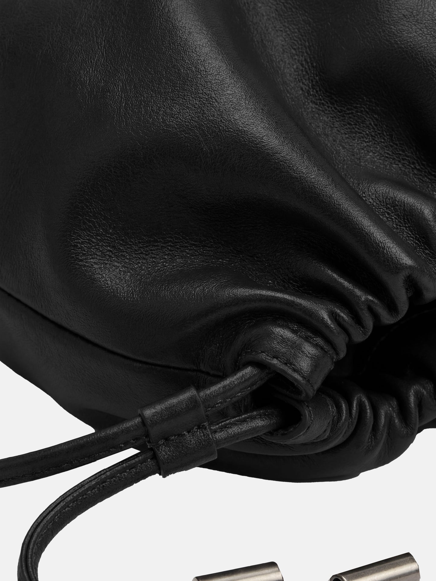 SELVANE soft drawstring pouch bag in a gentle, rounded silhouette with gathered top and secure strap.
