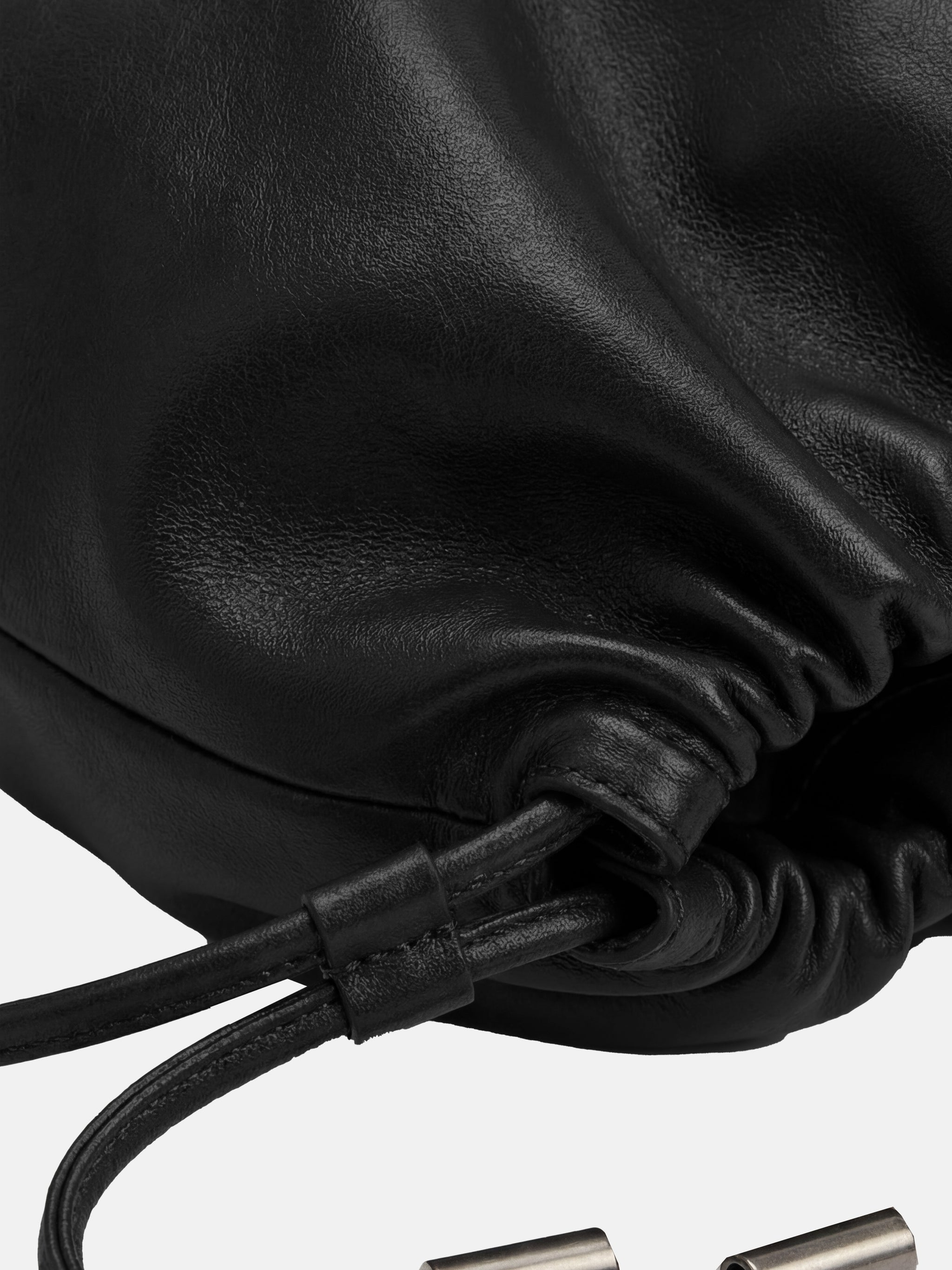 SELVANE soft drawstring pouch bag in a gentle, rounded silhouette with gathered top and secure strap.