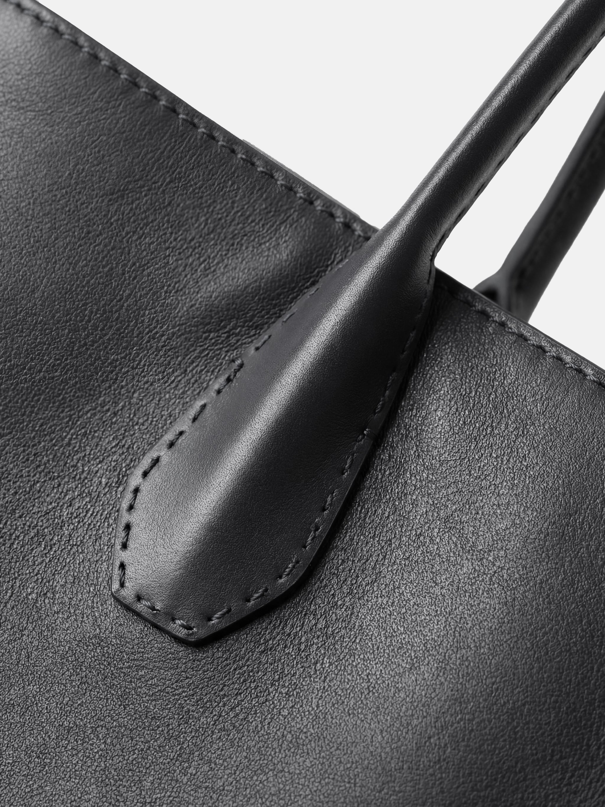 SELVANE Saddle Leather Crescent Tote Bag, featuring clean curvature, a grounded base, and long handles.