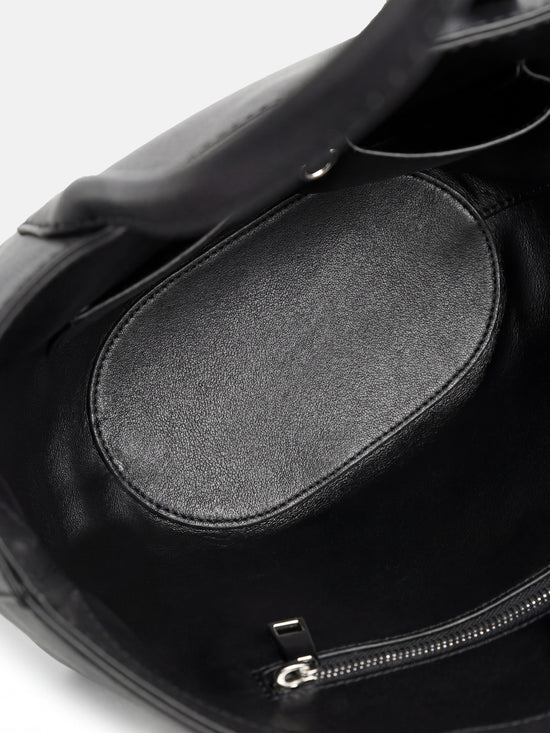 SELVANE Saddle Leather Crescent Tote Bag, featuring clean curvature, a grounded base, and long handles.