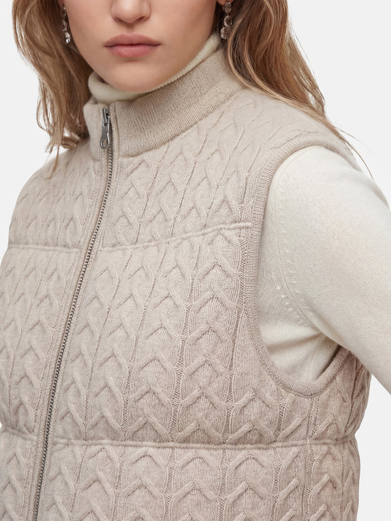 SELVANE zip-front cashmere vest with stand collar and subtle cable texture, shown layered for crisp silhouette.