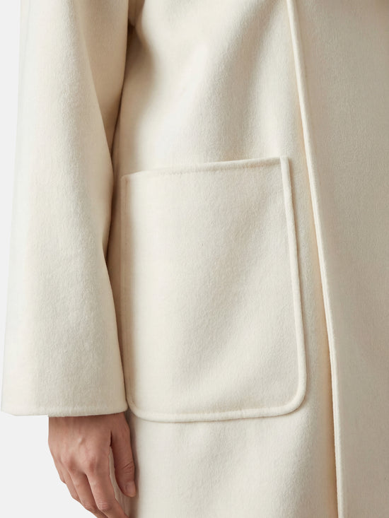 SELVANE Wrap-Scarf Cashmere Coat in a relaxed, cocooning silhouette with sculpted funnel neck and integrated diagonal wrap-scarf.