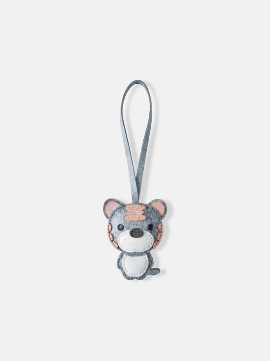 Hand-stitched leather Selvane Tiger Bag Charm, showcasing a playful yet fierce, bold, and compact design.