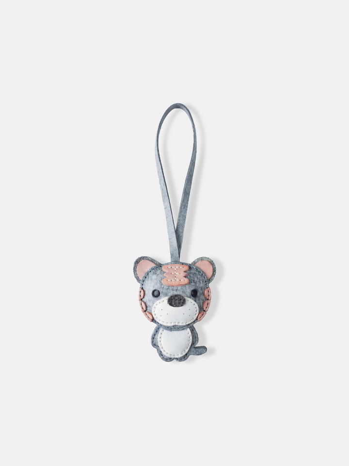 Hand-stitched leather Selvane Tiger Bag Charm, showcasing a playful yet fierce, bold, and compact design.