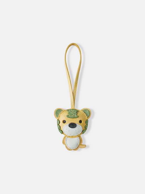 Hand-stitched leather Selvane Tiger Bag Charm, showcasing a playful yet fierce, bold, and compact design.