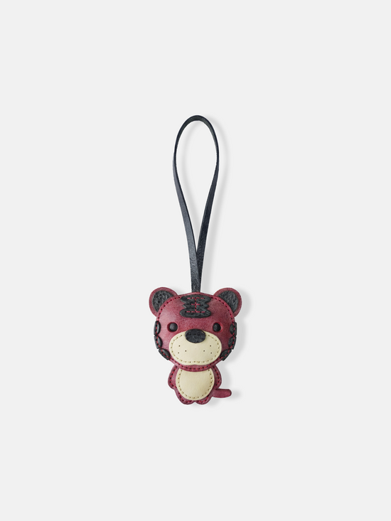 Hand-stitched leather Selvane Tiger Bag Charm, showcasing a playful yet fierce, bold, and compact design.