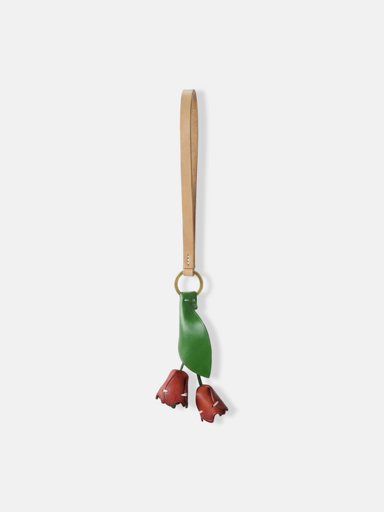 Selvane Tulip Pendant Bag Charm featuring a slender leather strap and a delicate tulip silhouette, designed as a quiet accent.