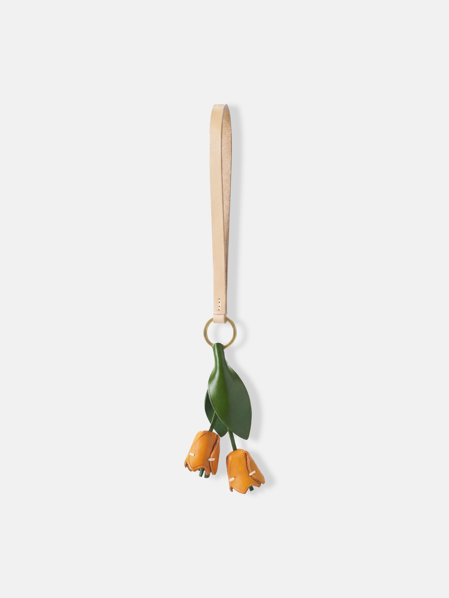 Selvane Tulip Pendant Bag Charm featuring a slender leather strap and a delicate tulip silhouette, designed as a quiet accent.