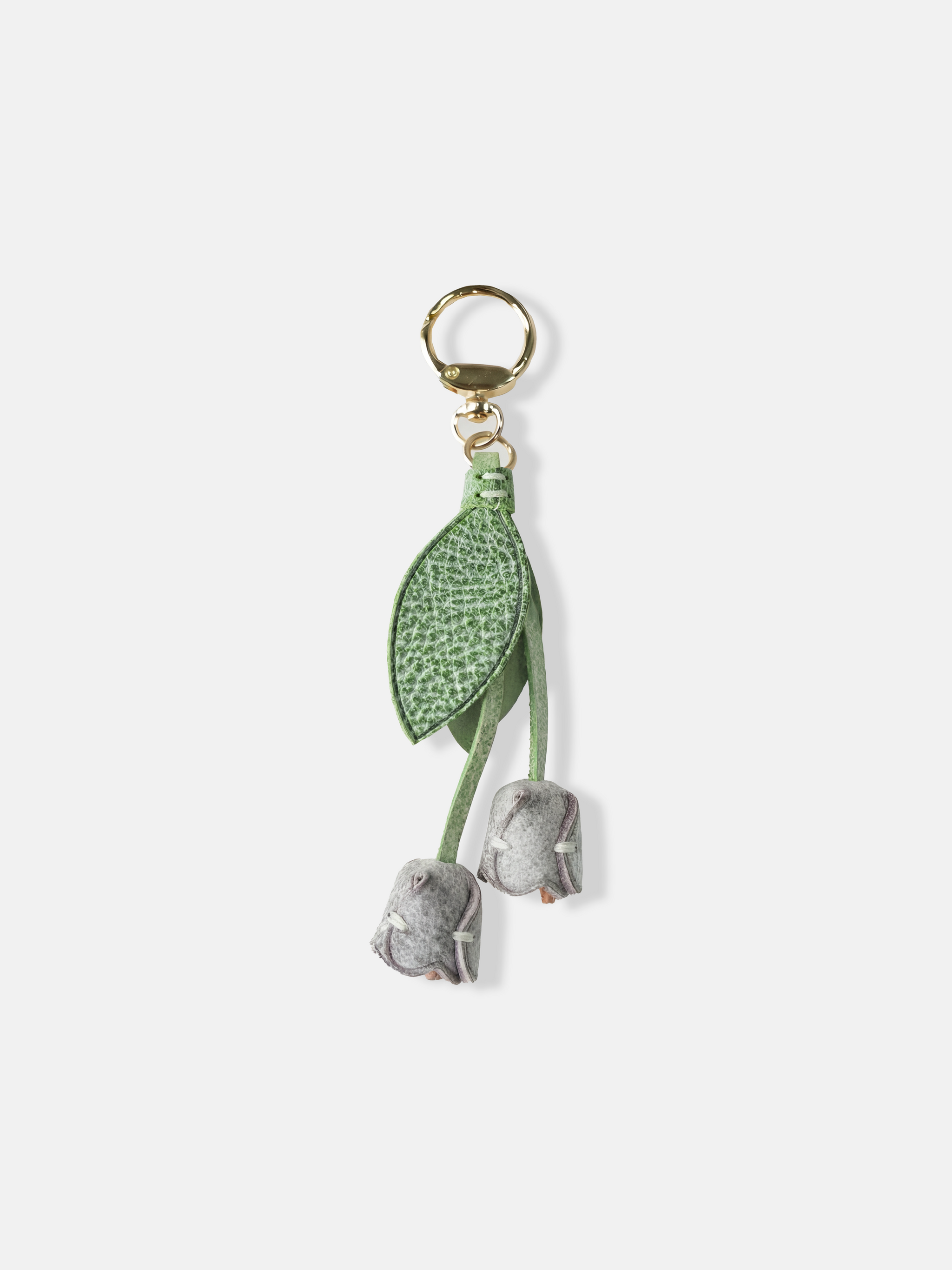 Selvane Tulip Bag Charm, a slender leather strap with a gentle tulip silhouette, designed as a quiet, dimensional accent.