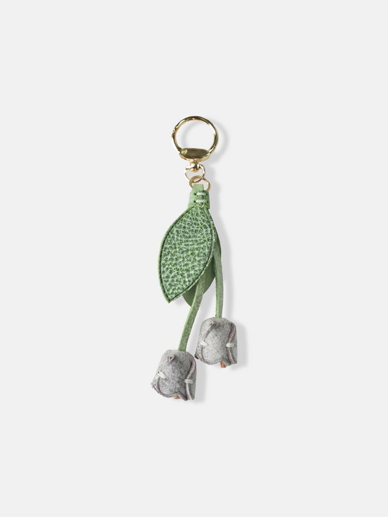 Selvane Tulip Bag Charm, a slender leather strap with a gentle tulip silhouette, designed as a quiet, dimensional accent.