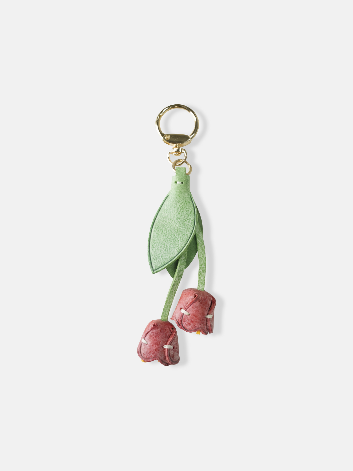 Selvane Tulip Bag Charm, a slender leather strap with a gentle tulip silhouette, designed as a quiet, dimensional accent.