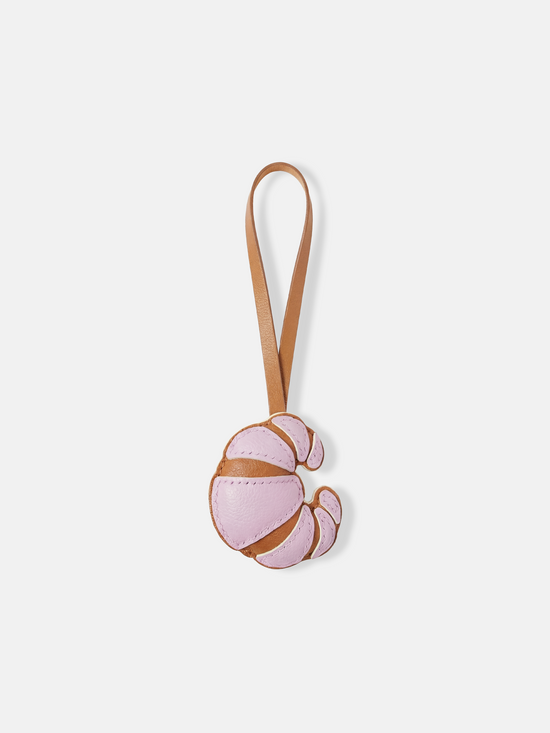 Selvane Croissant Bag Charm, a compact crescent of supple leather with rounded volume and clean seams, designed to sway.