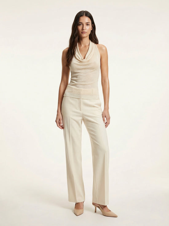 SELVANE warm ivory cowl-neck halter top, featuring architectural drape, semi-sheer fine-gauge knit, and relaxed body-skimming silhouette.