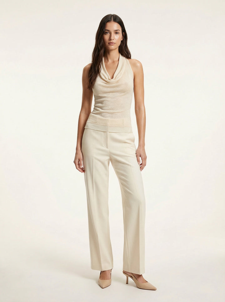 SELVANE warm ivory cowl-neck halter top, featuring architectural drape, semi-sheer fine-gauge knit, and relaxed body-skimming silhouette.