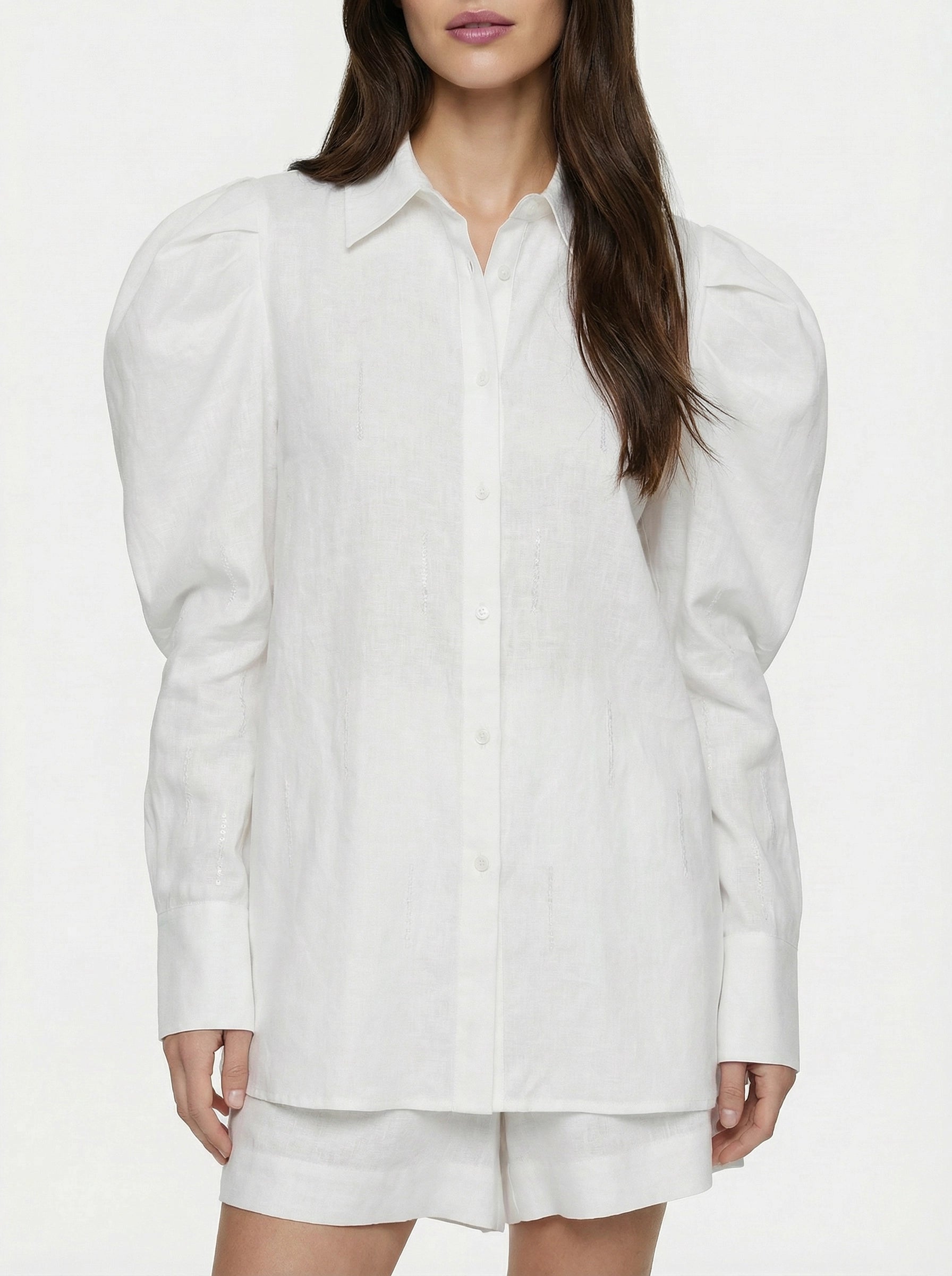 SELVANE white linen-cotton Embroidered Shirt & Shorts Set. Oversized shirt with scattered text, puffed sleeves, French cuffs, matching shorts.