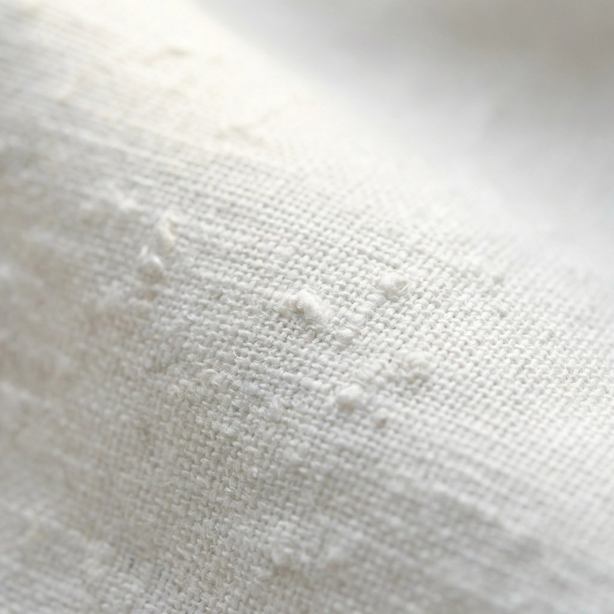 SELVANE white linen-cotton Embroidered Shirt & Shorts Set. Oversized shirt with scattered text, puffed sleeves, French cuffs, matching shorts.