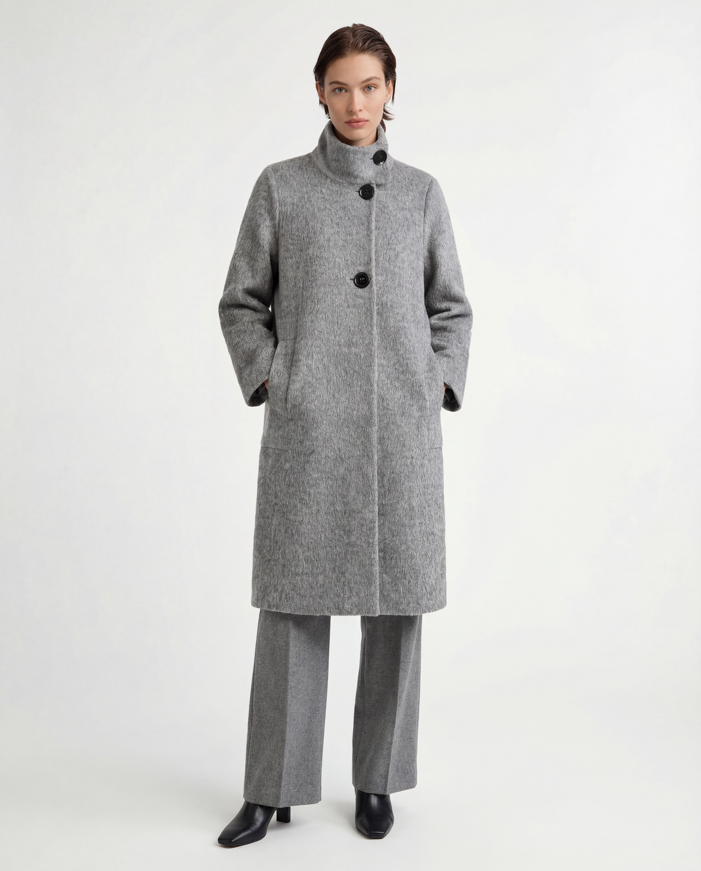 Tailored grey camel hair stand-up collar coat, full-length, structured body, soft brushed surface, elegant silhouette.