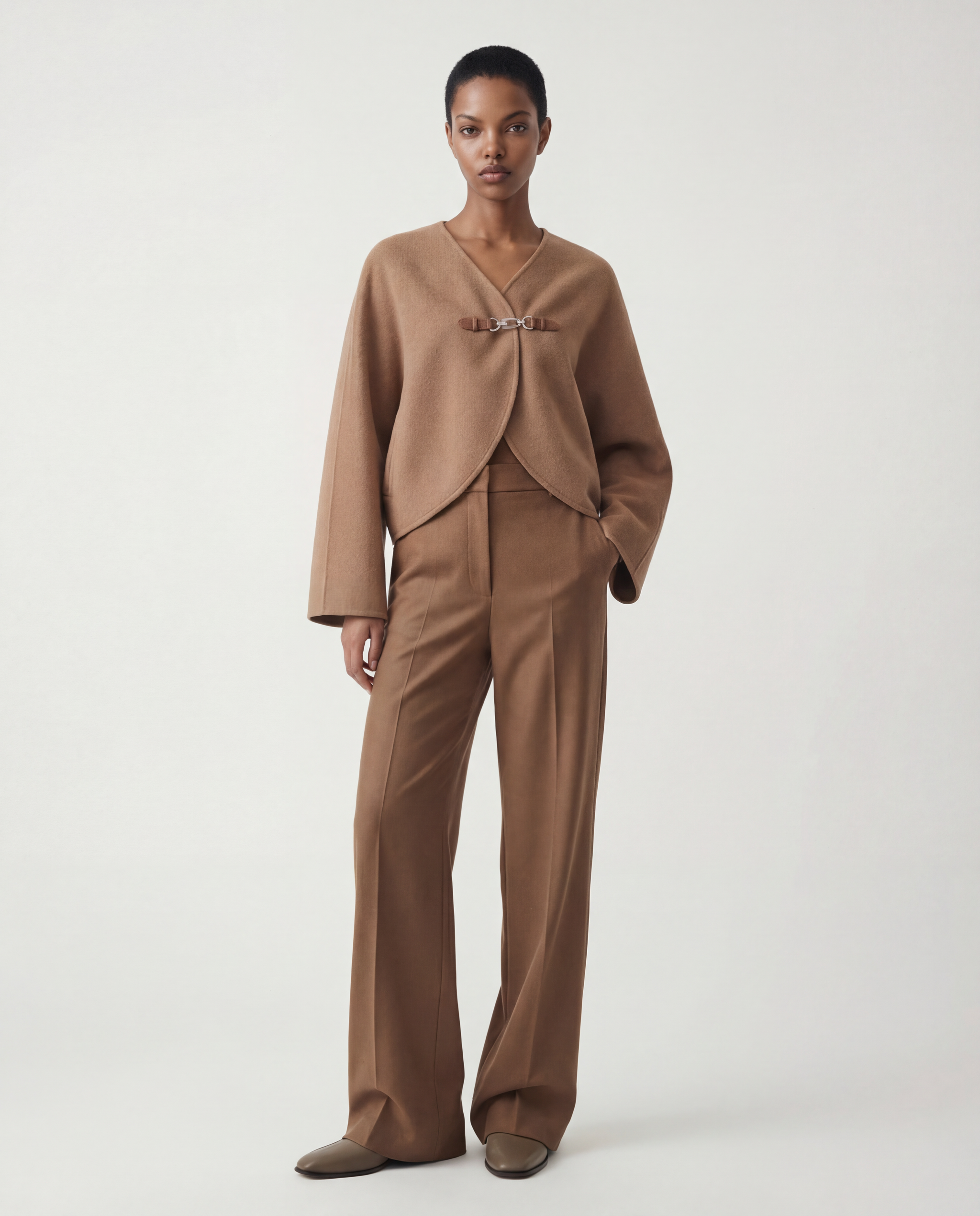 SELVANE Buckled Cape-Style Wool Jacket in khaki, featuring a dramatic cape drape and a single waist buckle.