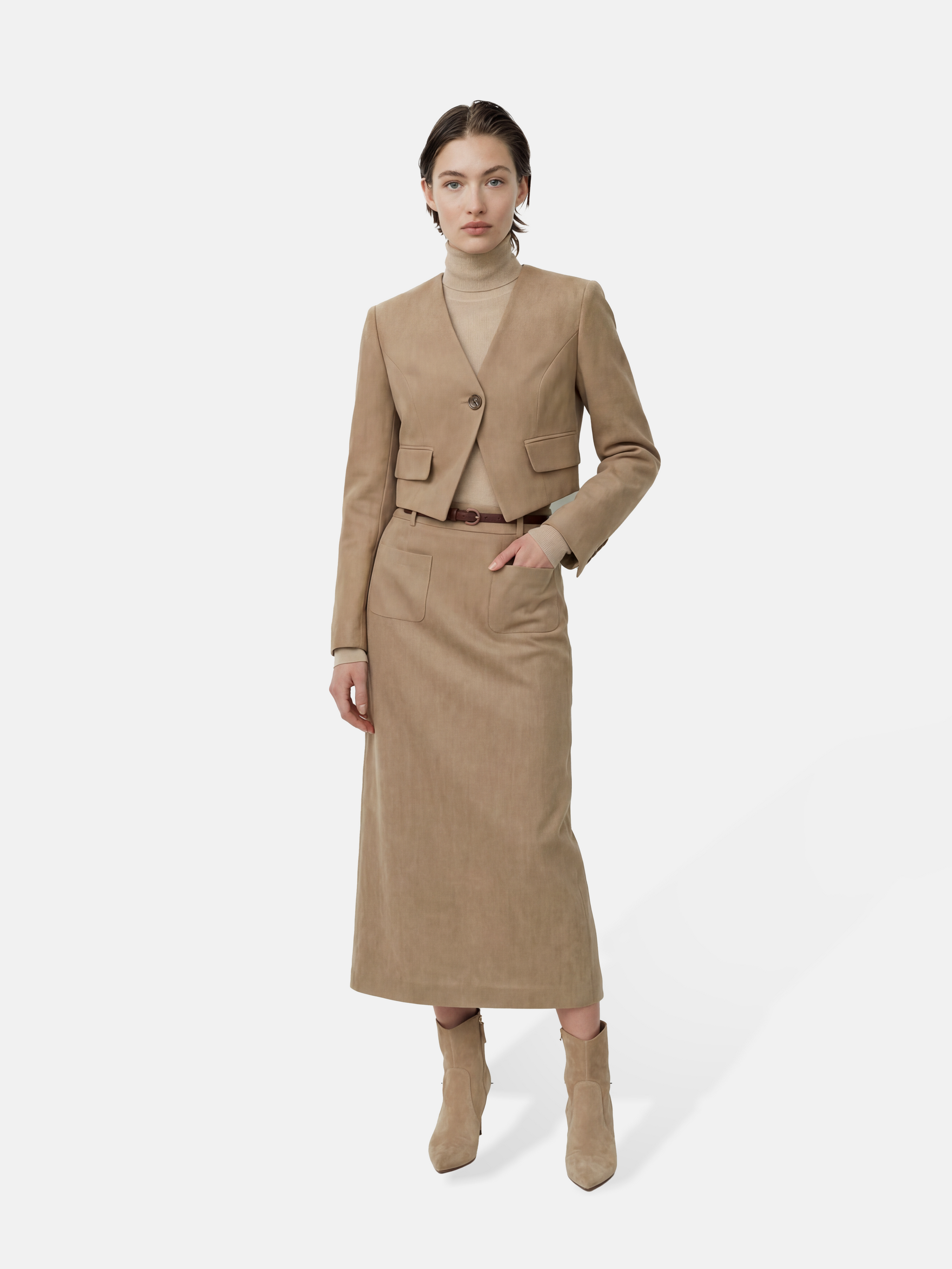 SELVANE Tailored Linen Suit Set in apricot, featuring a cleanly cut jacket and sleek skirt with a subtle metallic glint.
