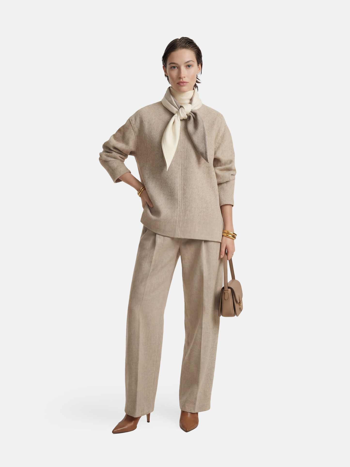 Muted apricot structured top by SELVANE, featuring a clean front seam, sculpted cuffs, and a detachable contrast scarf detail.