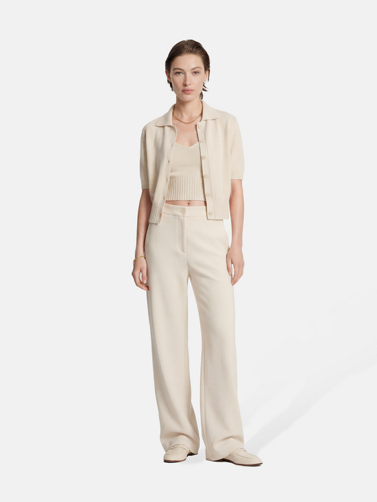 SELVANE Crease-Front Wide-Leg Trousers in a deep hue, showcasing crisp front creases and controlled volume, worn by a model in motion.