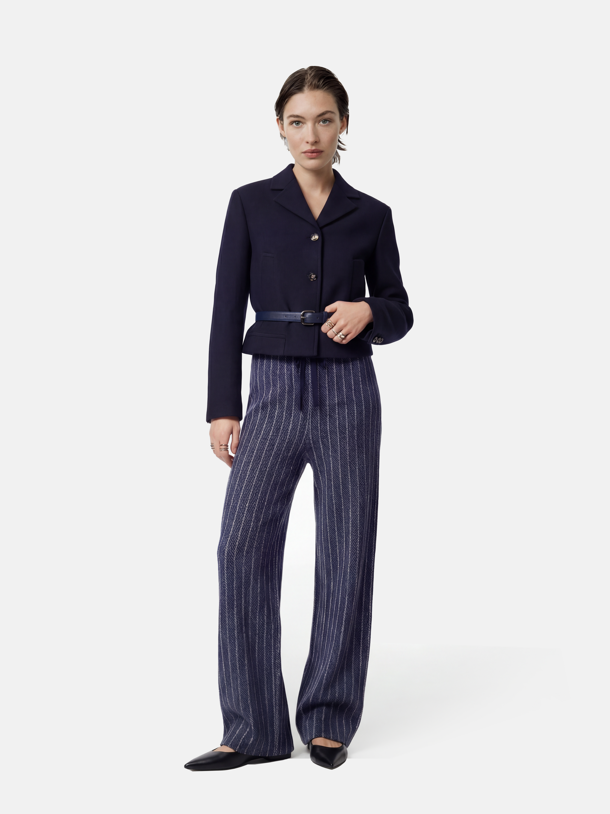 Full-length navy striped cashmere drawstring trousers with a relaxed, straight leg, shown draped cleanly.