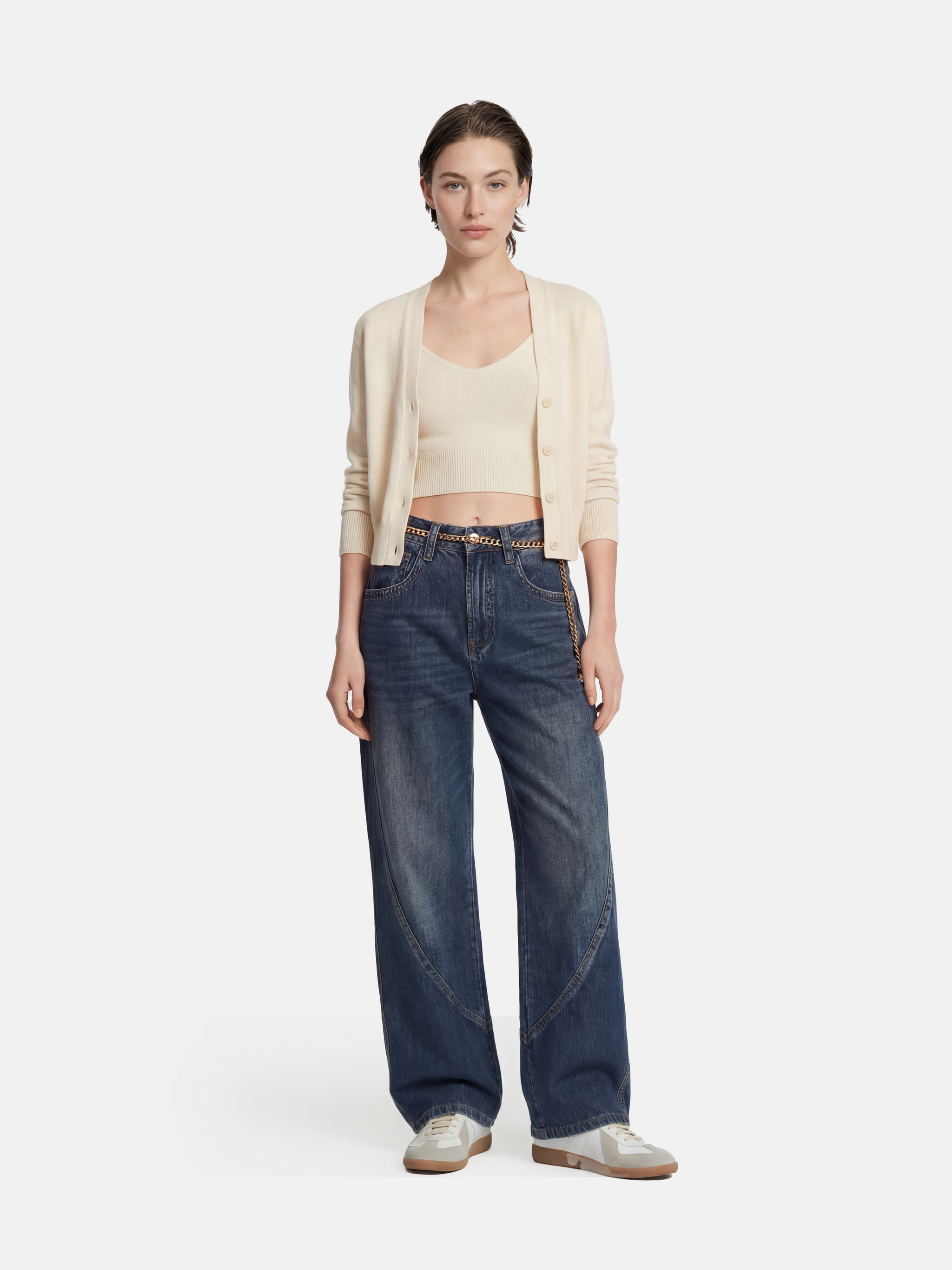 Model wearing high-rise SELVANE Sculpted Seam Wide-Leg Jeans in mid-wash pure cotton denim, showcasing the curved front seams.