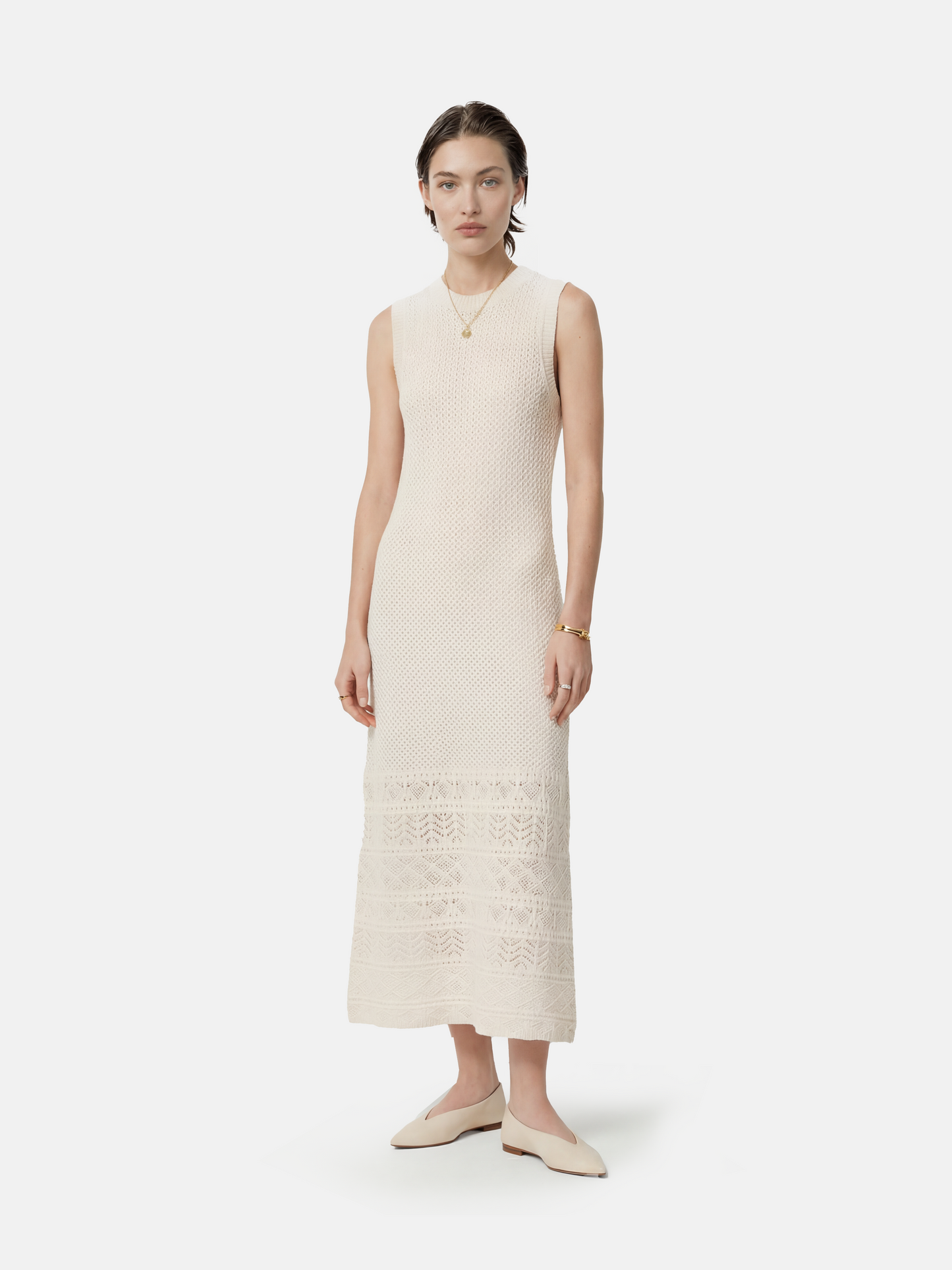 SELVANE Cashmere Open-Knit Sleeveless Maxi Dress in a natural setting, showcasing its elongated fall and airy texture.