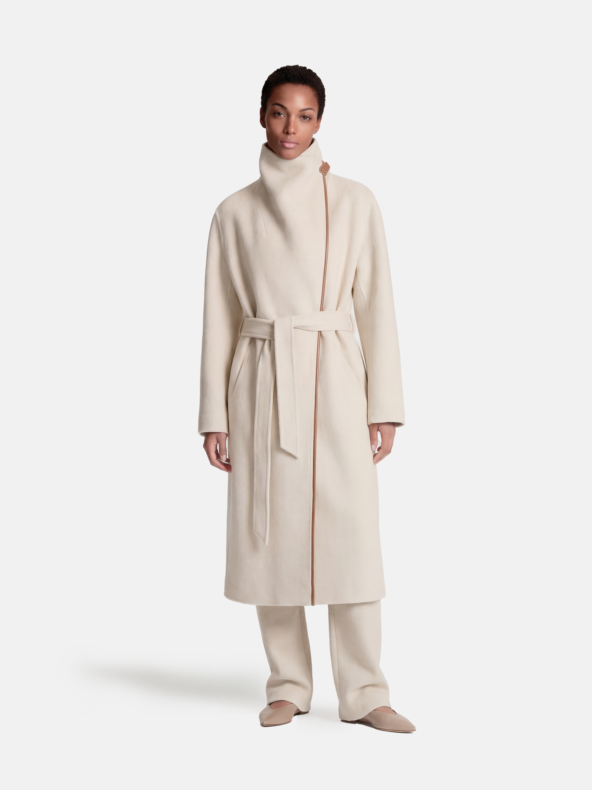 SELVANE Contour Wool Wrap Coat in a light tone with contrast-trim edges and wide shawl collar, draped elegantly.
