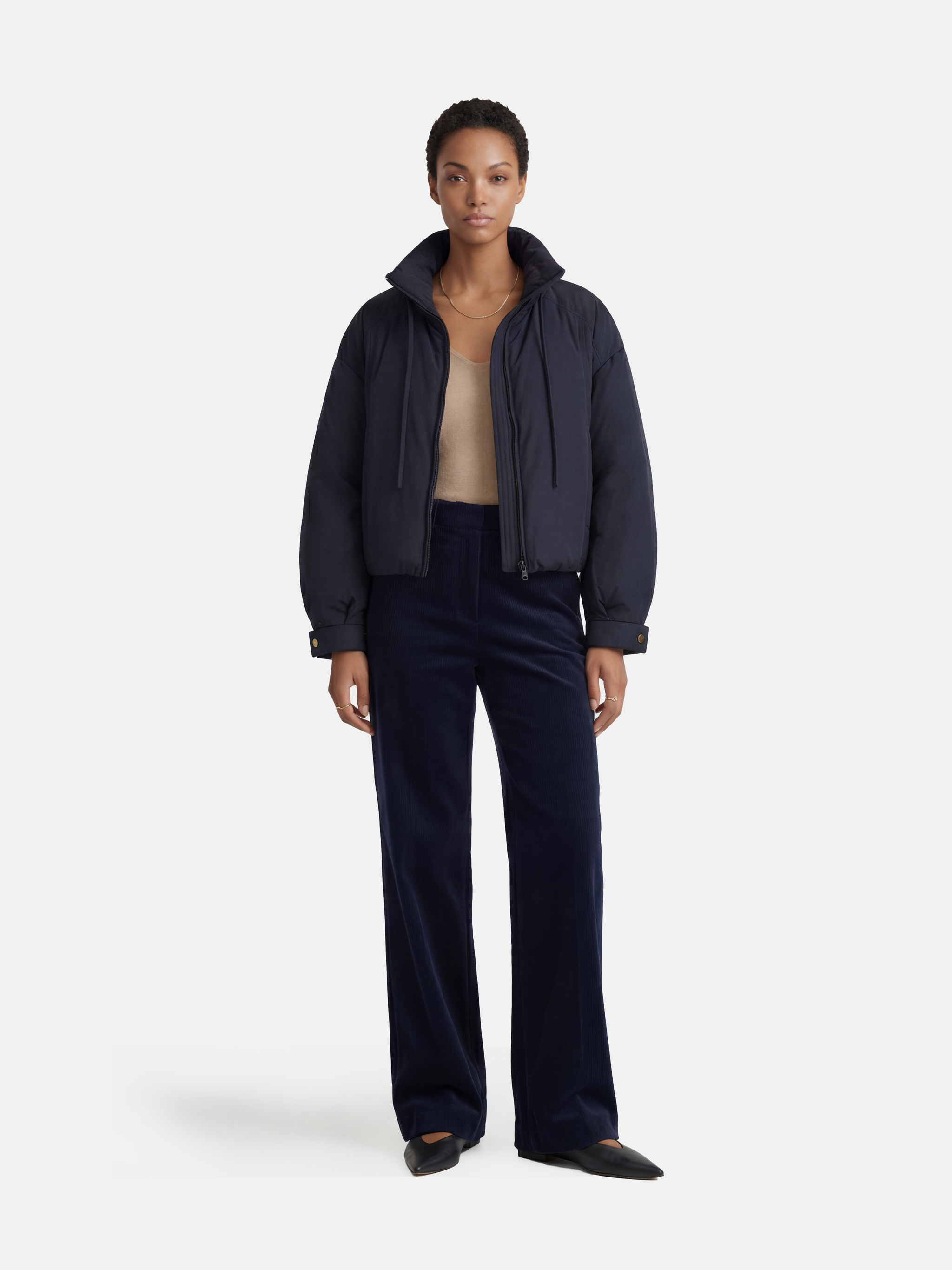 SELVANE High-Neck Bomber Down Jacket in black, featuring an exaggerated high collar and rounded silhouette, refined matte finish.