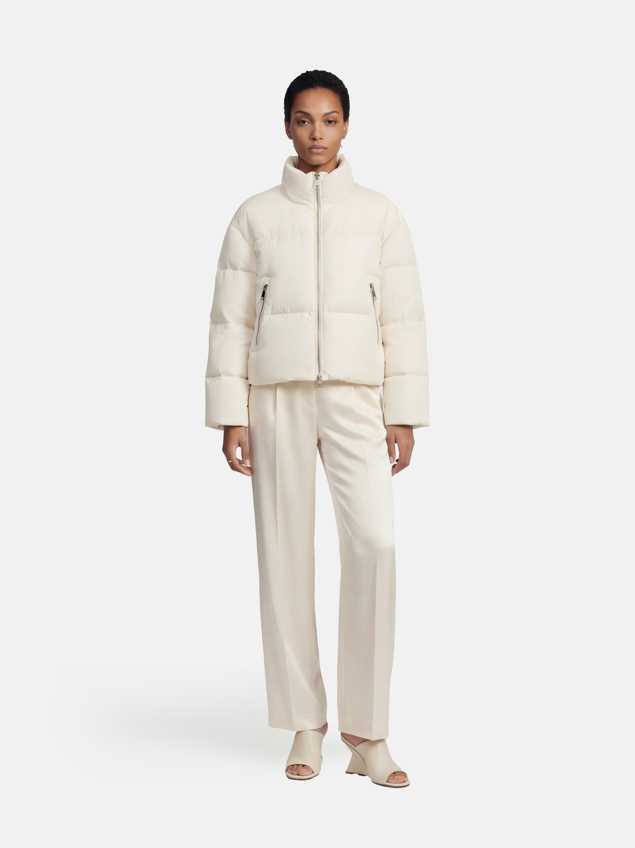 SELVANE Minimal Padded Down Jacket, cropped with a subtle stand collar, crisp panel quilting, and a soft matte finish, embodying sculptural volume.