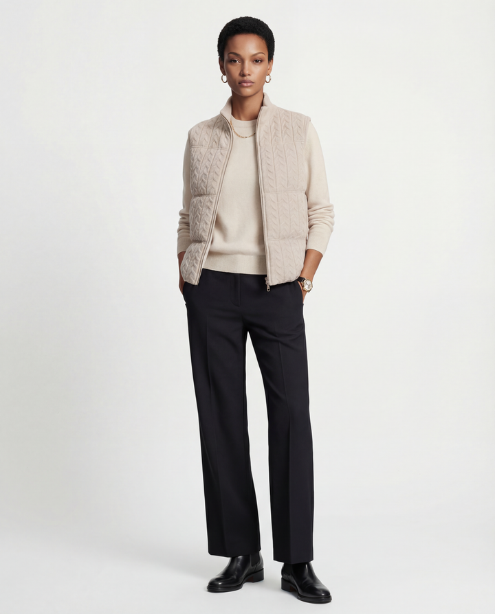 SELVANE zip-front cashmere vest with stand collar and subtle cable texture, shown layered for crisp silhouette.