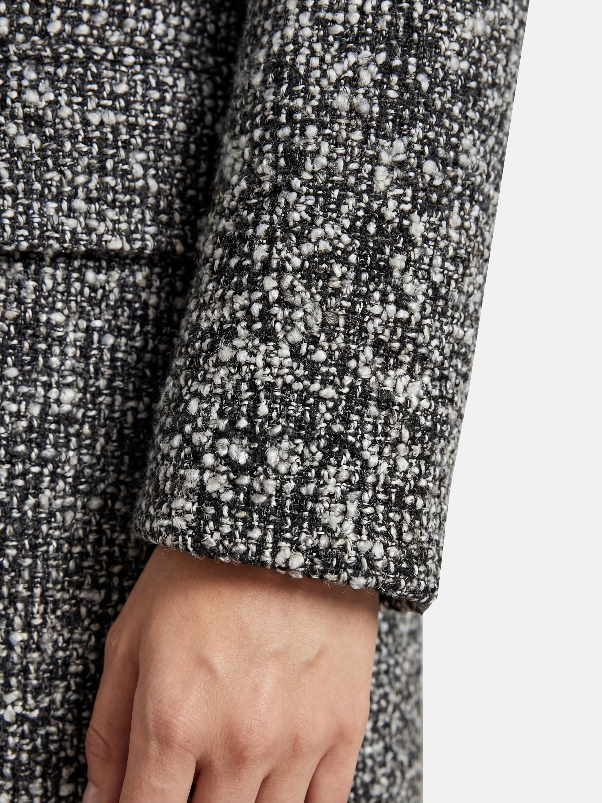 SELVANE Herringbone Wool-Blend Coat, long streamlined silhouette, V-neck, wrap-front, sculpted waist, monochrome herringbone, contrast placket.