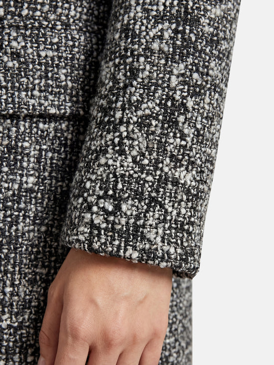SELVANE Herringbone Wool-Blend Coat, long streamlined silhouette, V-neck, wrap-front, sculpted waist, monochrome herringbone, contrast placket.