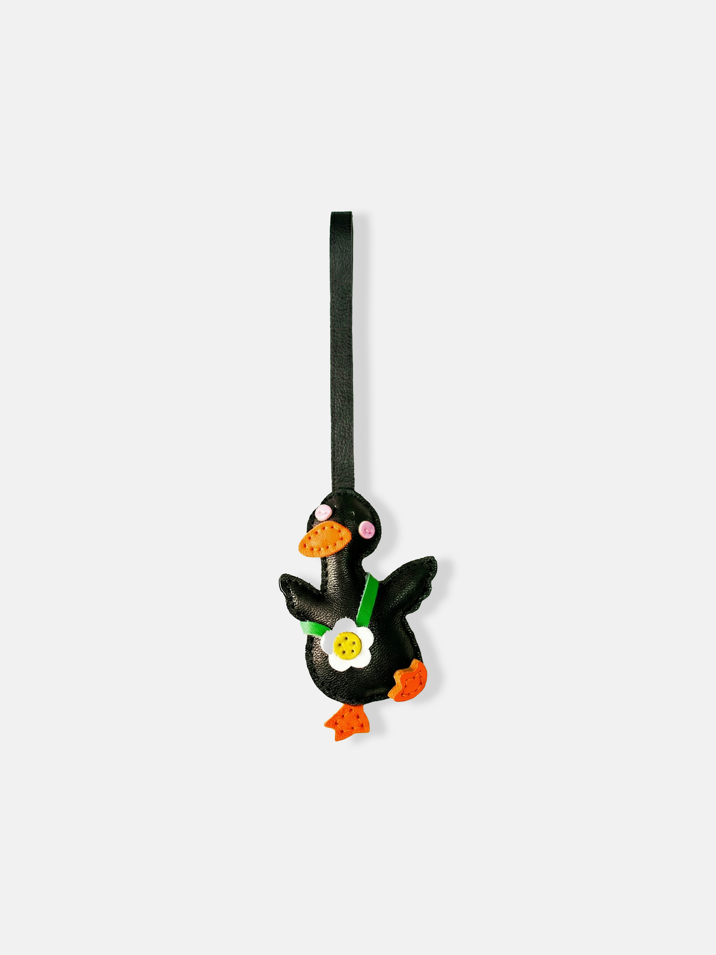 Selvane Daisy Duck bag charm, featuring a rounded duck silhouette with lifted wings and a central daisy detail, crafted with refined artistry.