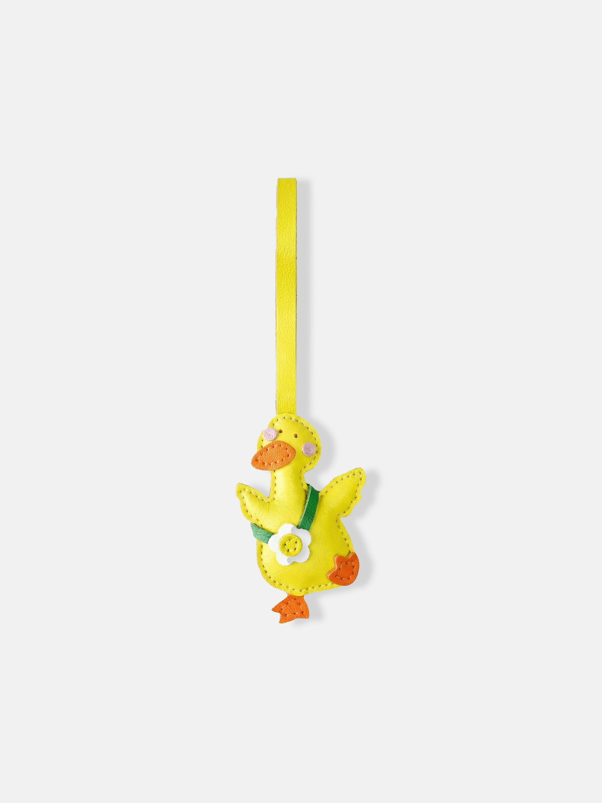 Selvane Daisy Duck bag charm, featuring a rounded duck silhouette with lifted wings and a central daisy detail, crafted with refined artistry.