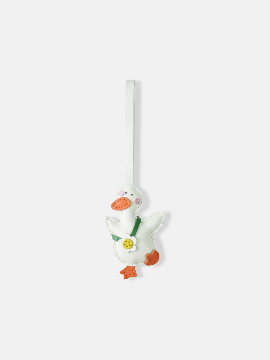 Selvane Daisy Duck bag charm, featuring a rounded duck silhouette with lifted wings and a central daisy detail, crafted with refined artistry.