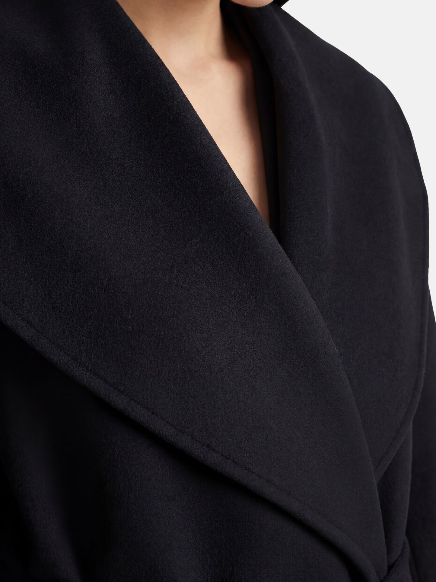SELVANE mid-length wrap coat in quiet camel pure cashmere, with exaggerated shawl collar and long belt, for elegant motion.