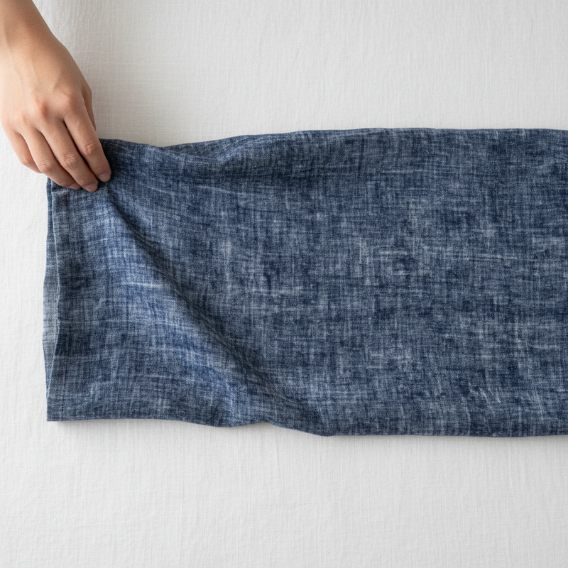 Lay flat to dry on a clean surface — hanging may stretch the relaxed silhouette