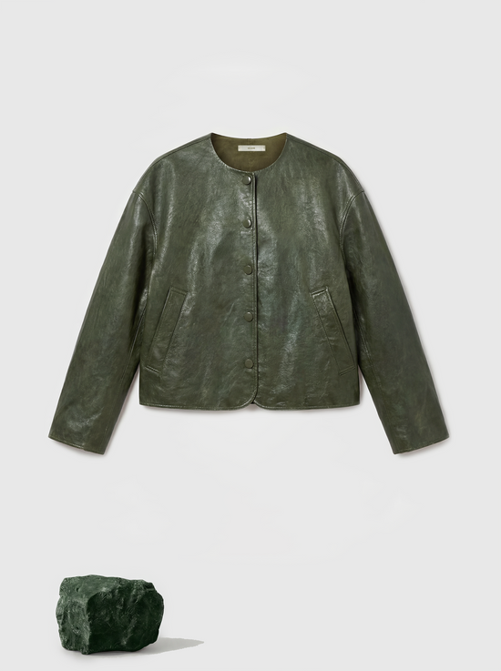 Cropped olive lambskin jacket with a clean round neckline and tonal buttons, showcasing a precise, composed silhouette.
