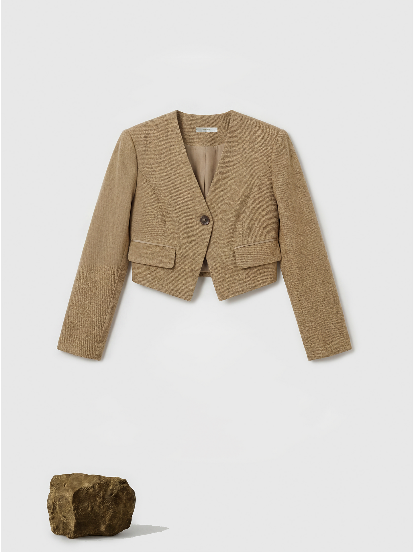 SELVANE Tailored Linen Suit Set in apricot, featuring a cleanly cut jacket and sleek skirt with a subtle metallic glint.