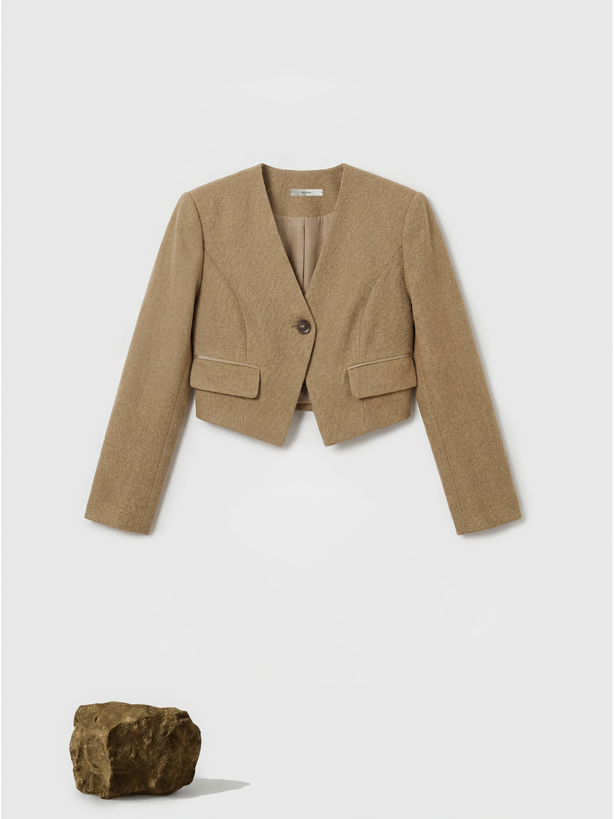 SELVANE Tailored Linen Suit Set in apricot, featuring a cleanly cut jacket and sleek skirt with a subtle metallic glint.