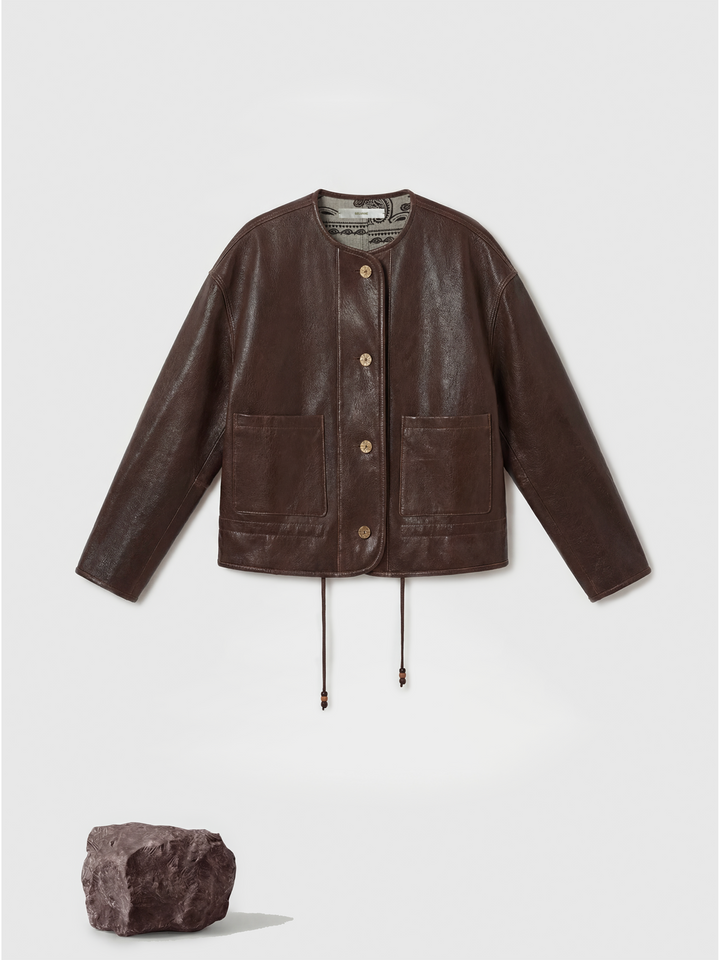 SELVANE brown lambskin crew-neck jacket with softened volume and drawstring hem, showcasing clean lines and supple texture.