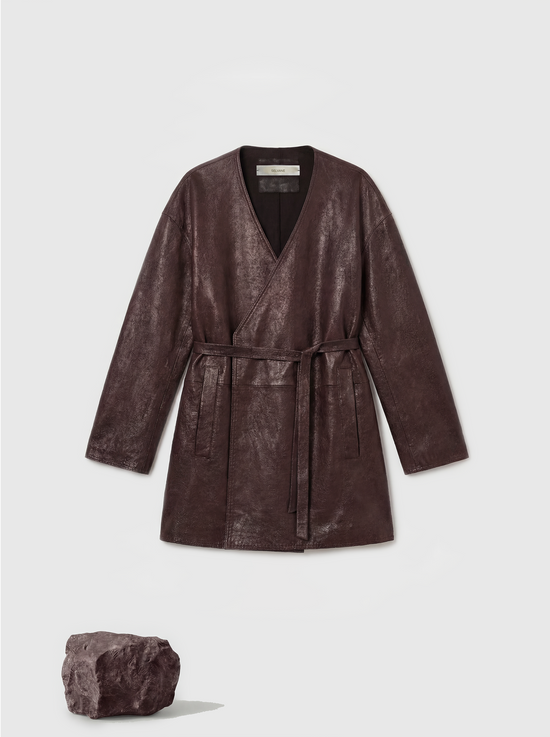 Sleek rich brown lambskin wrap belt jacket, defining the waist with a quiet gesture, clean column silhouette.